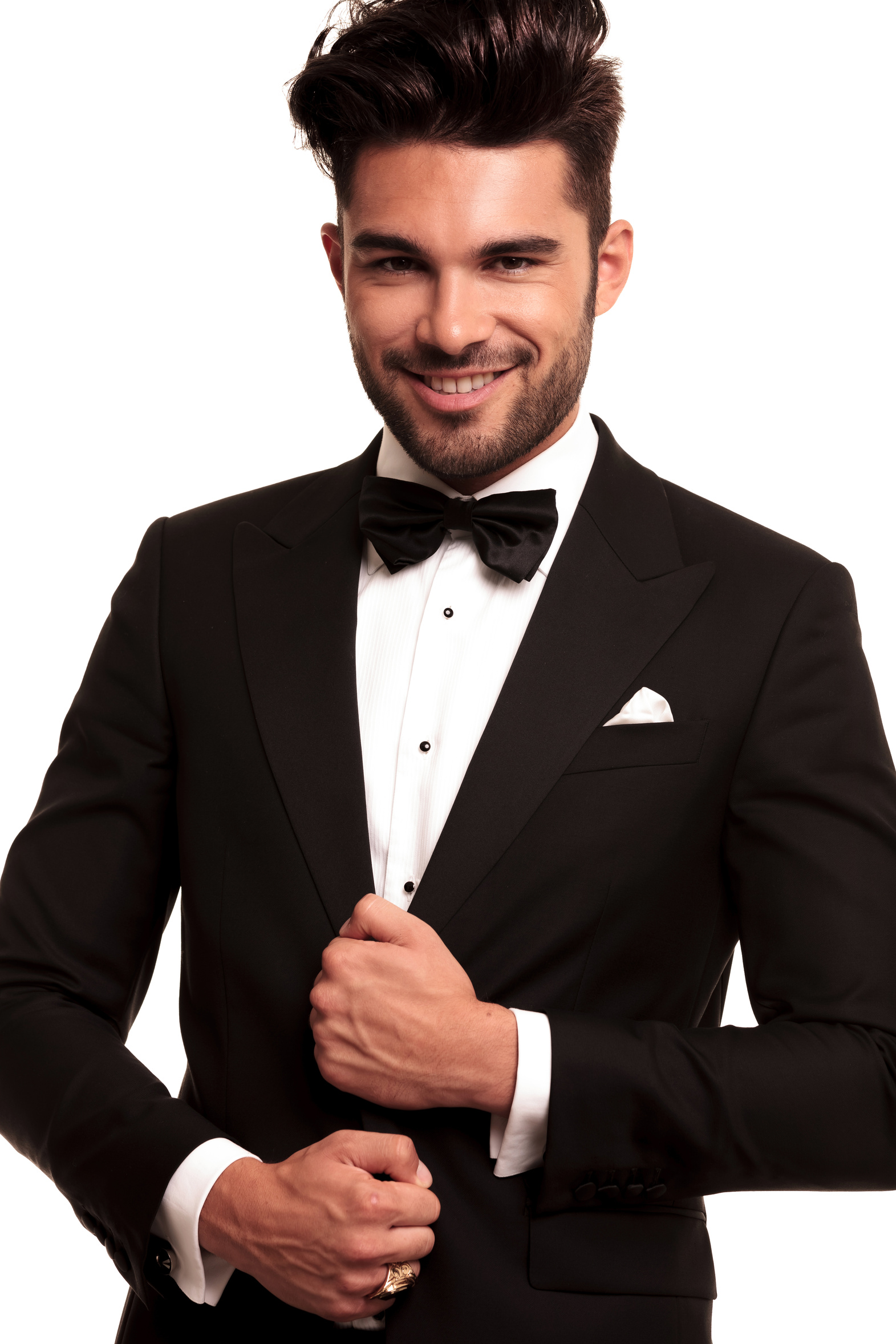 smiling young groom in tuxedo and bowtie